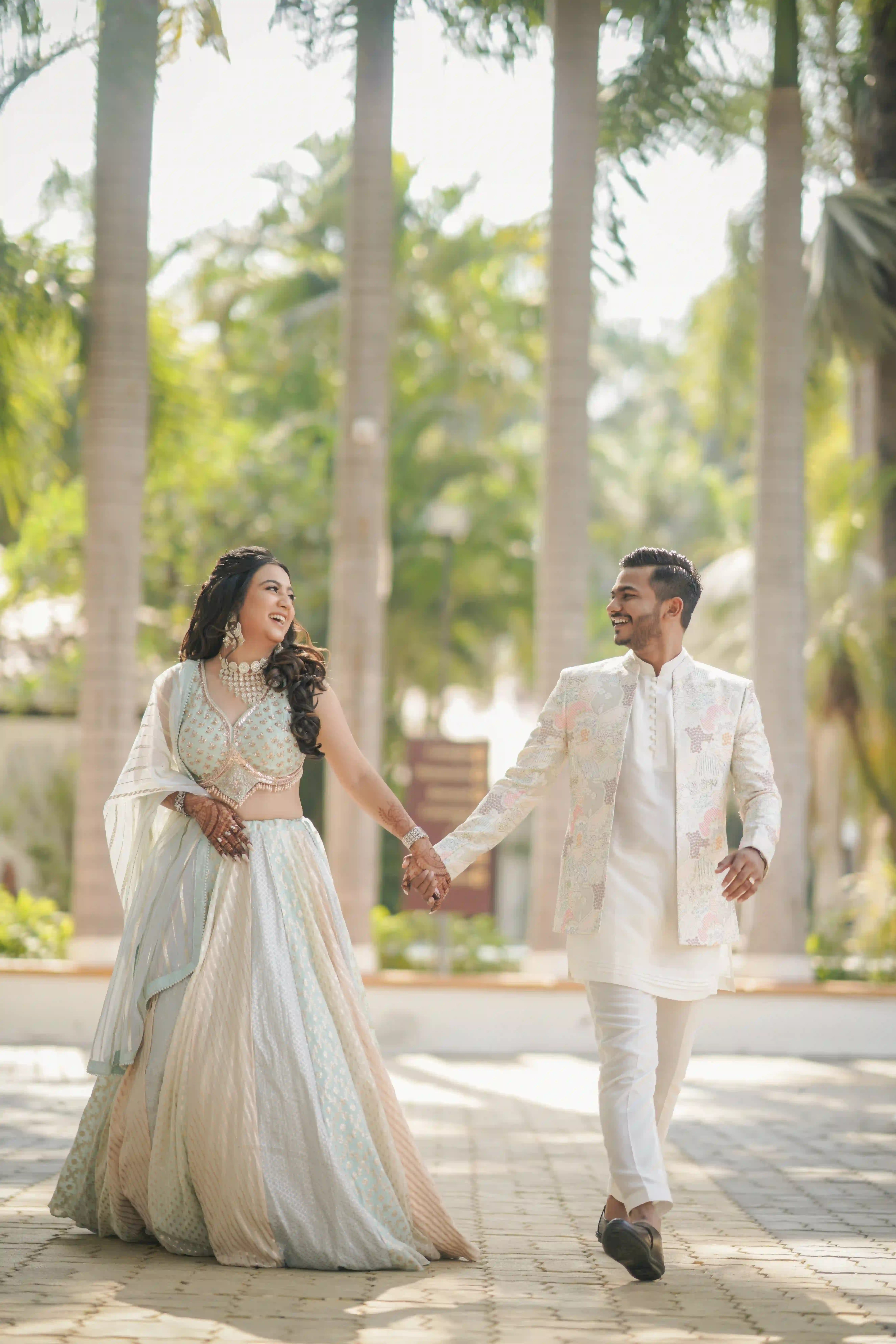 Couple walking hand in hand during a pre-wedding photoshoot